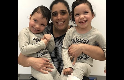 The Dischler twins, Molly and Isabelle, with their teacher Yalitza.
